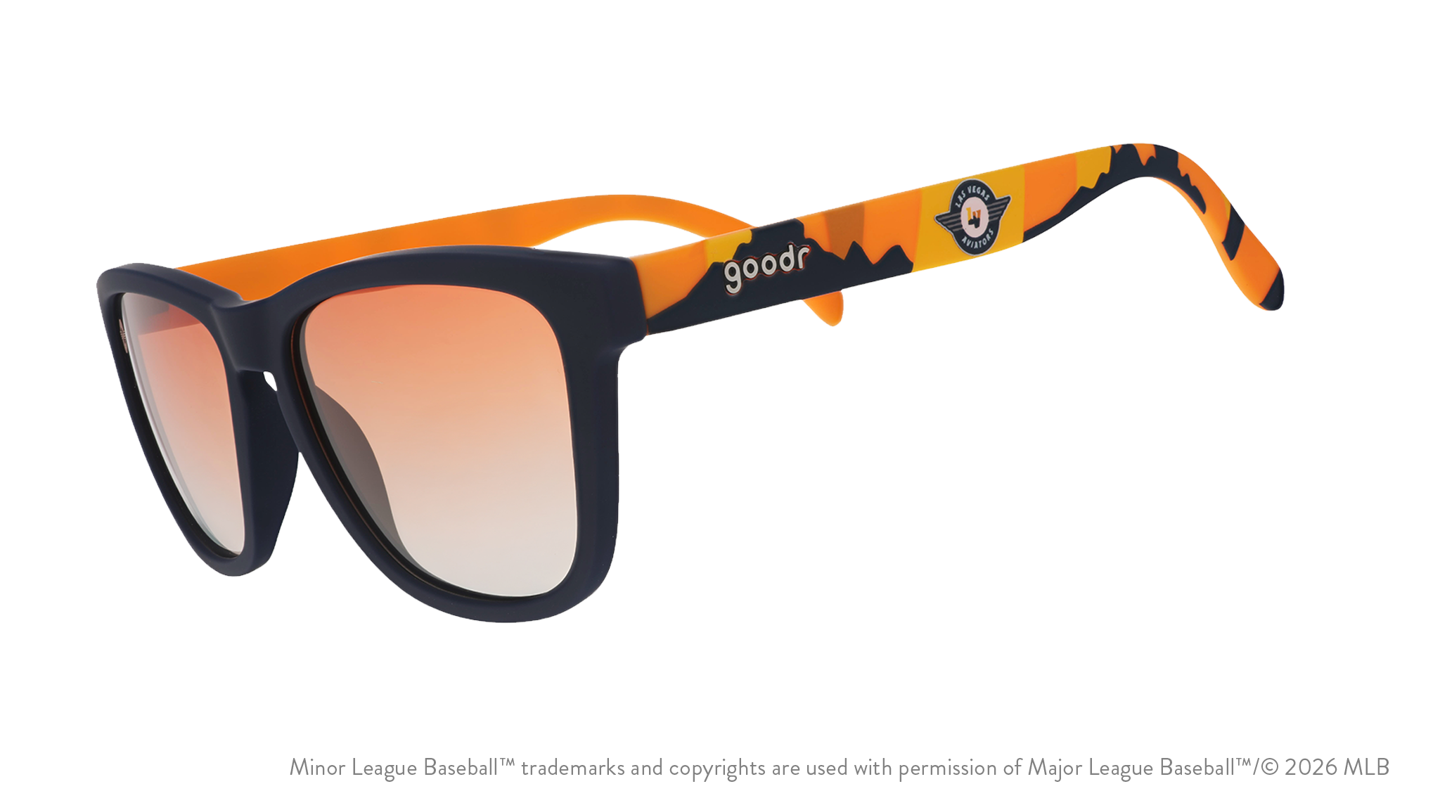 Angled view of shades tilted down. Blue frames w/ an orange+yellow landscape, Aviators logo+orange gold gradient lenses.