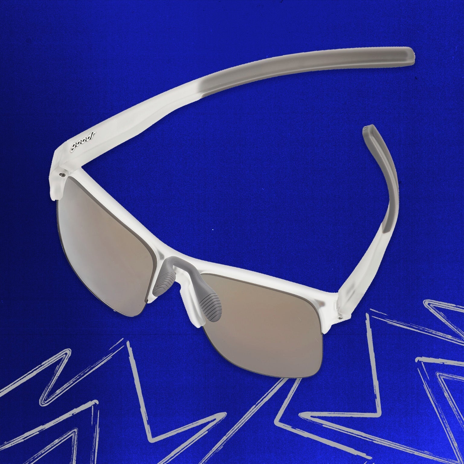 Three-quarter angle back view of clear shades w/half-rim frames+blue reflective lenses tilted down on a blue background.