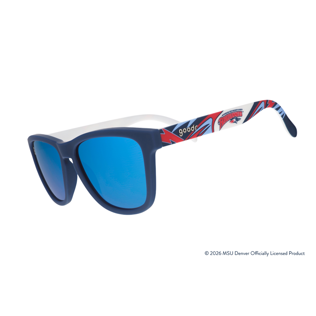 Three-quarter angle view of sunglasses. Solid blue frames w/ a red + white Roadrunners pattern + blue reflective lenses.