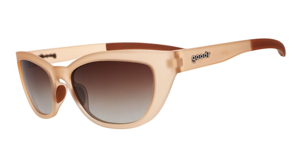 Three-quarter angle view of a pair of translucent brown cat-eye Cheetah Gs with brown gradient lenses.