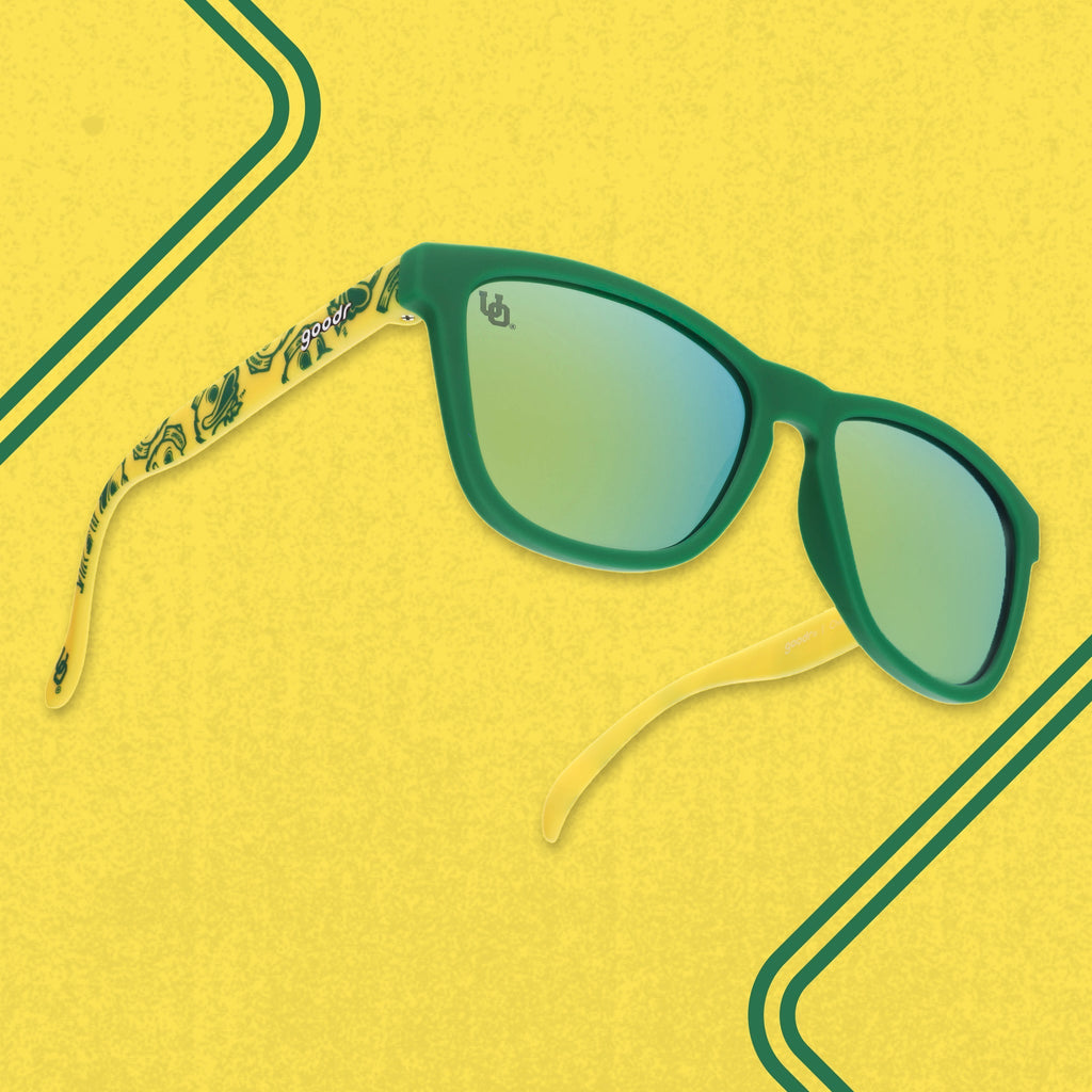 Three quarter angle of yellow-and-green shades featuring the Oregon Ducks duck mascot against a yellow background.