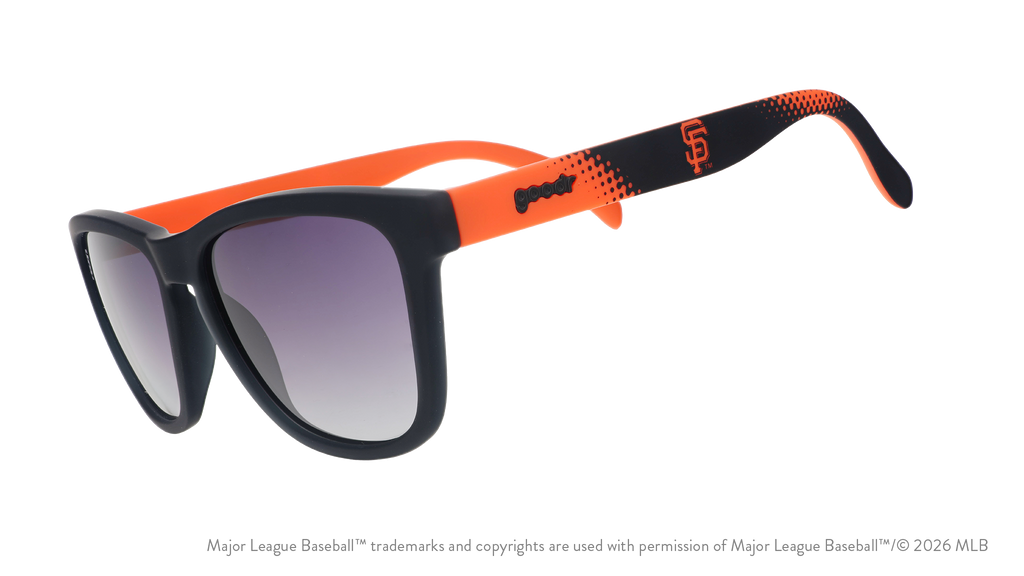 Three-quarter angle view of a pair of black and orange Giants sunglasses featuring the SF logo on the arm.