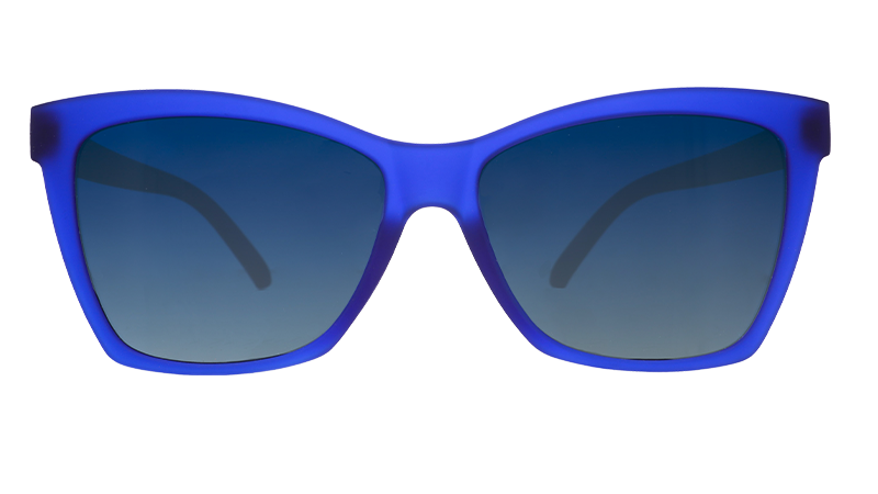 Front view of translucent dark blue angled cat-eye sunglasses with blue gradient lenses.