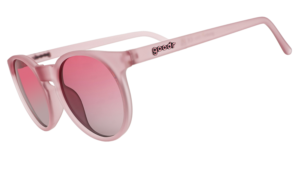 A pair of pink goodr sunglasses with round frames and pink lenses