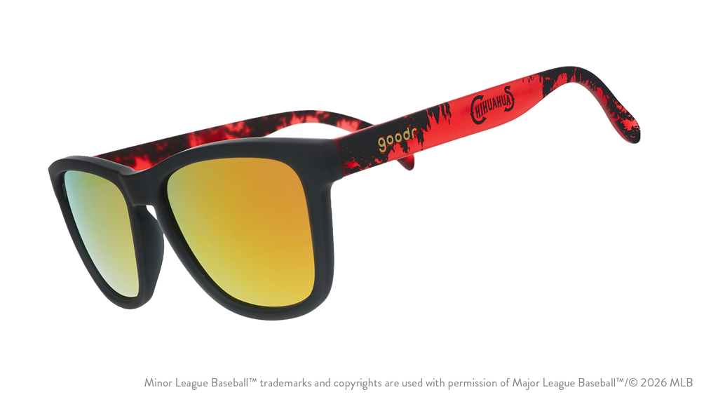 Angled view of shades tilted down. Dark gray+red frames w/ Chihuahuas on temples. Amber reflective lenses.