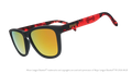 Angled view of shades tilted down. Dark gray+red frames w/ Chihuahuas on temples. Amber reflective lenses.