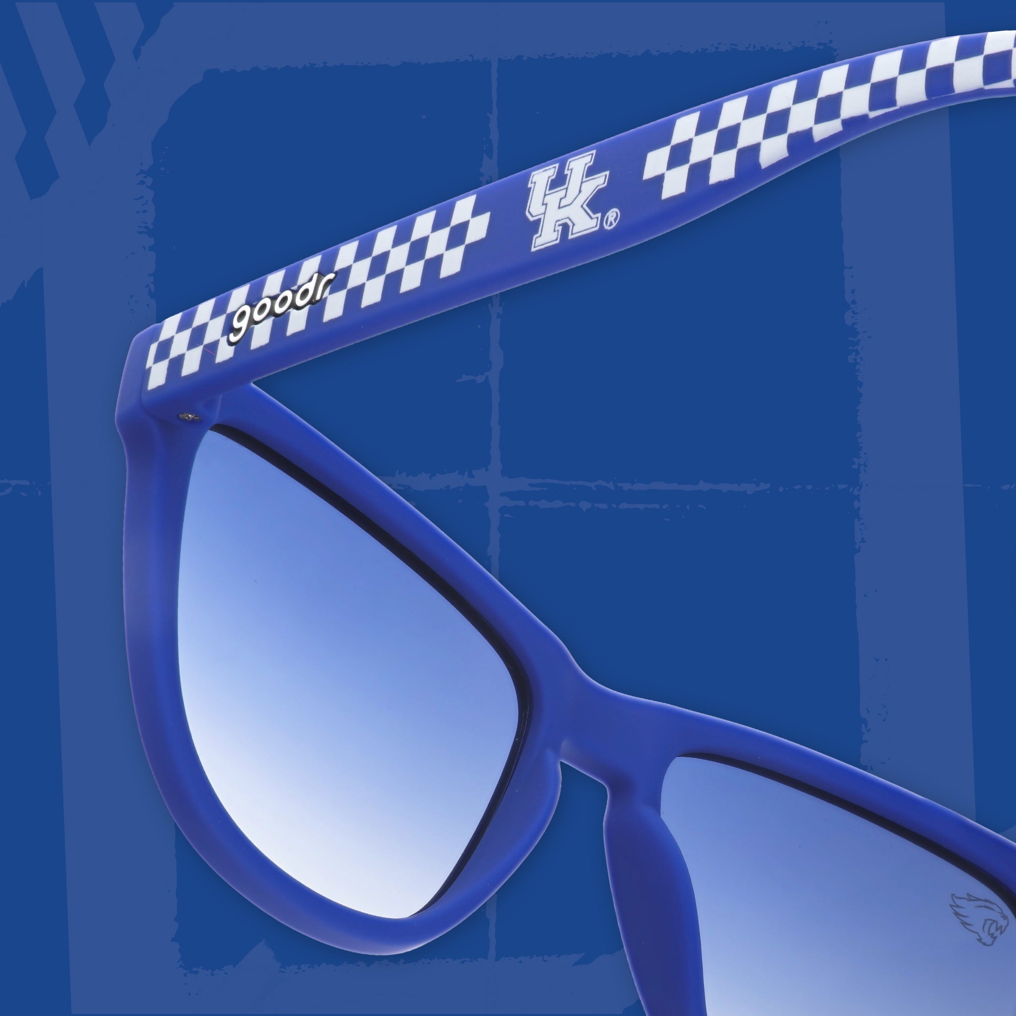 Close-up back view of blue and white checkered sunglasses featuring blue gradient lenses and the University of Kentucky logo on a blue background.