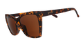Three-quarter angle view of brown tortoiseshell angled cat-eye sunglasses with non-reflective brown lenses.