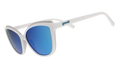 White cat-eye sunglasses with light blue mirrored lenses on a blue patterned background.