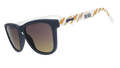 Three-quarter view of black and white sunglasses with a golden sunrise pattern, the Seattle Reign logo, and gray-to-yellow ocean gradient lenses.