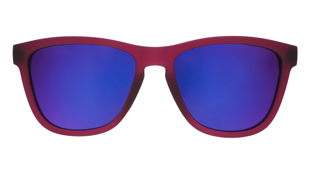Front view of translucent purple sunglasses featuring a classic frame and reflective purple lenses.