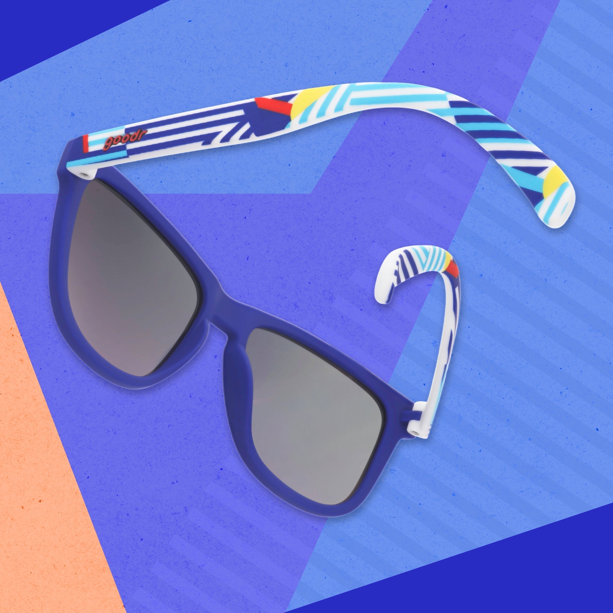 A pair of blue sunnies depicting a geometric nautical-inspired design on the arms, photographed from behind.