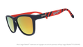Three-quarter angle view of shades. Dark blue frames w/ a red pattern, WooSox on temples + amber reflective lenses.