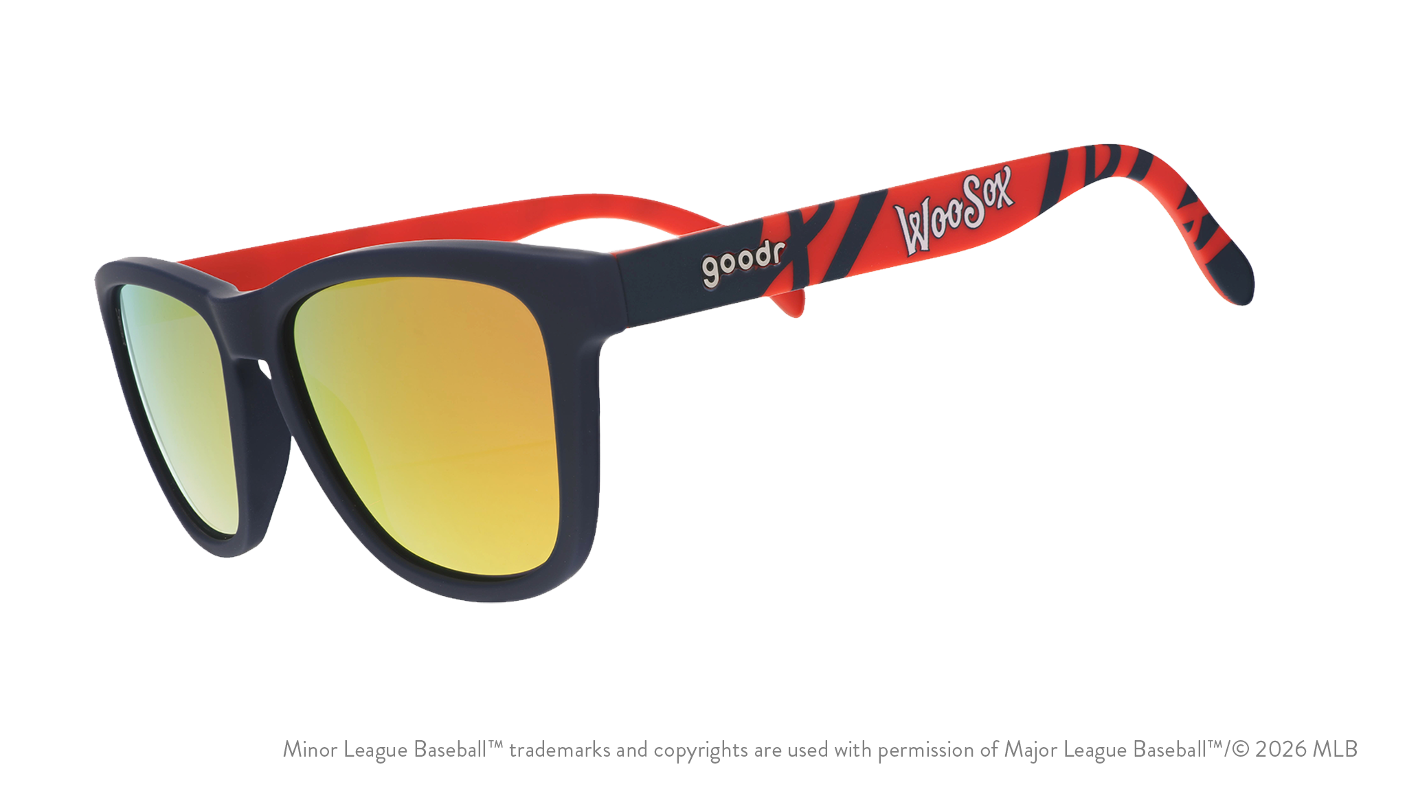 Three-quarter angle view of shades. Dark blue frames w/ a red pattern, WooSox on temples + amber reflective lenses.