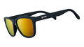 Three-quarter angle view of square-shaped black sunglasses with mirrored amber lenses.