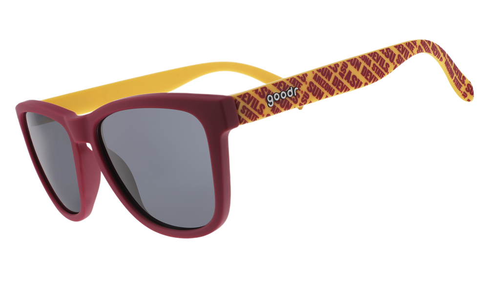 Three-quarter angle view of dark red and yellow sunglasses with an ASU print and black lenses.